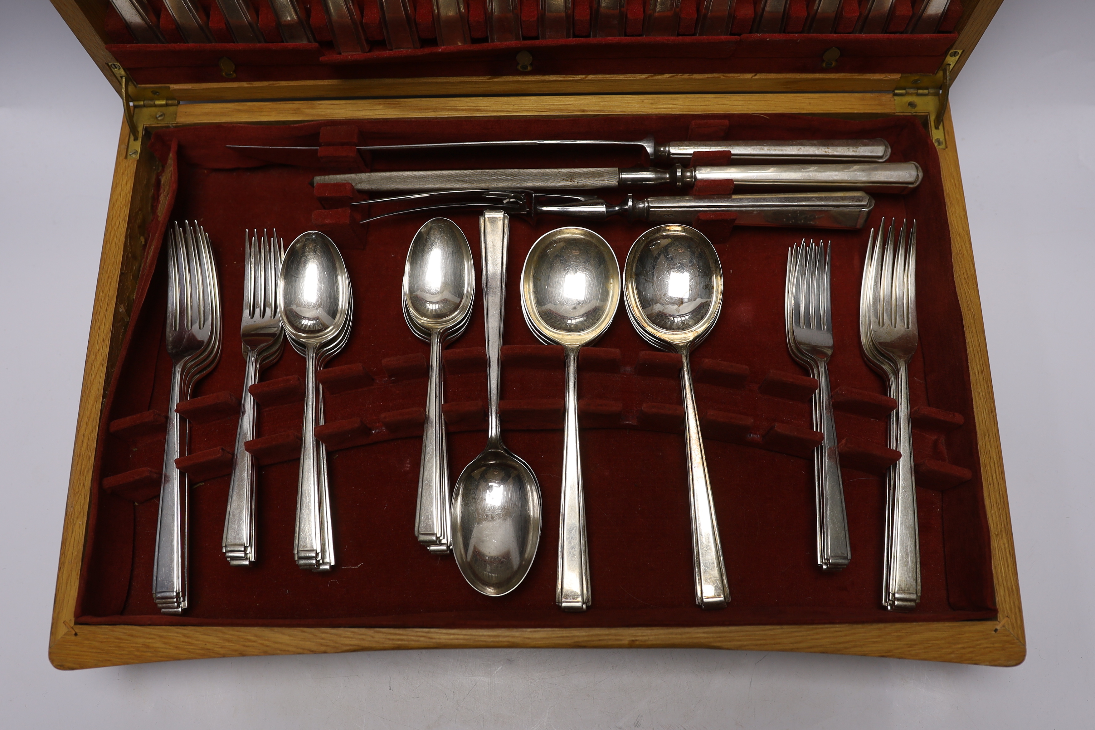 An Elizabeth II almost complete silver canteen of cutlery for eight by Cooper Brothers & Sons, comprising eight each of the following: soup spoons and dessert spoons, table and dessert forks and silver handled dessert an